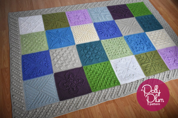 a crochet afghan of squares in various shades of blue, green, purple, and neutrals lays flat on a wood floor with a logo in the corner that reads "a Polly Plum pattern"